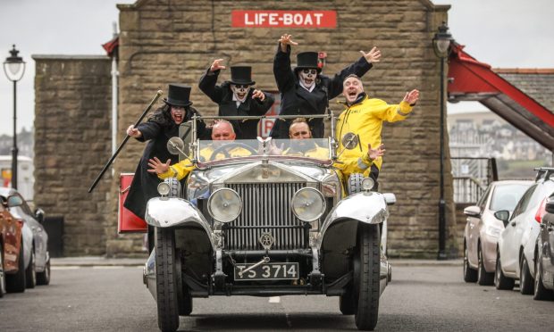 The Broughty Ferry lifeboat crew in a Rolls Royce with a coffin ahead of their spooky walking tours