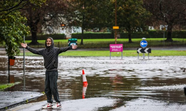 A local's show of defiance at the roundabout to Old Glamis Road. Image: Mhairi Edwards/DC Thomson