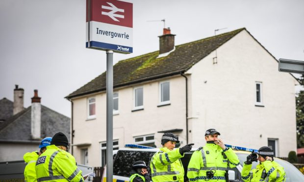 Emergency workers near Invergowrie railway station during rescue efforts on Friday. Image: Mhairi Edwards/DC Thomson