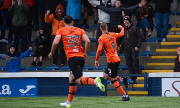 Louis Moult salutes the travelling Dundee United fans