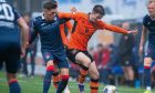 Dundee United's Declan Glass battles Josh Mullin