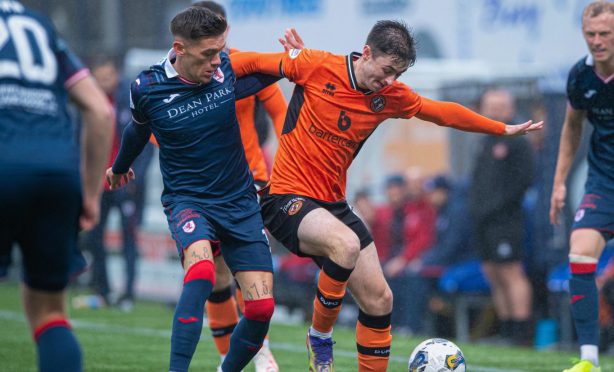 Dundee United's Declan Glass battles Josh Mullin