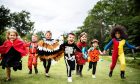 Kids playing in Halloween costumes