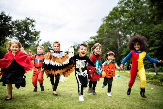 Kids playing in Halloween costumes