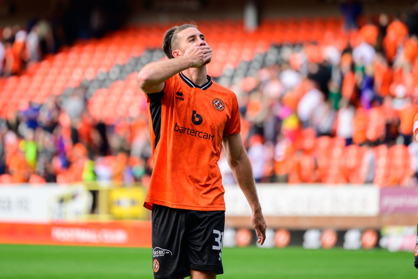 Dundee United defender Declan Gallagher blows a kiss to the crowd