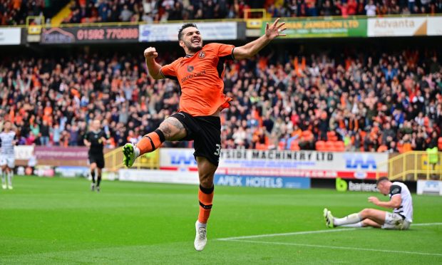 Dundee United star Tony Watt jumps for joy after levelling against Queen's Park