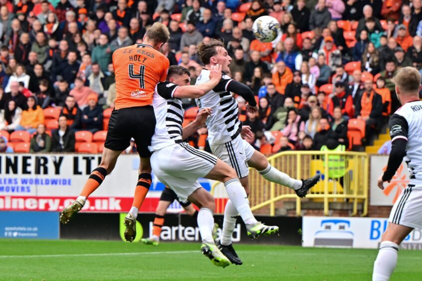 Kevin Holt narrowly heads wide during a Dundee United win over Queen's Park.