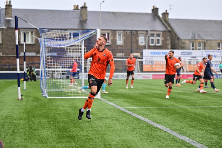 Louis Moult celebrates his leveller for Dundee United against Raith Rovers.