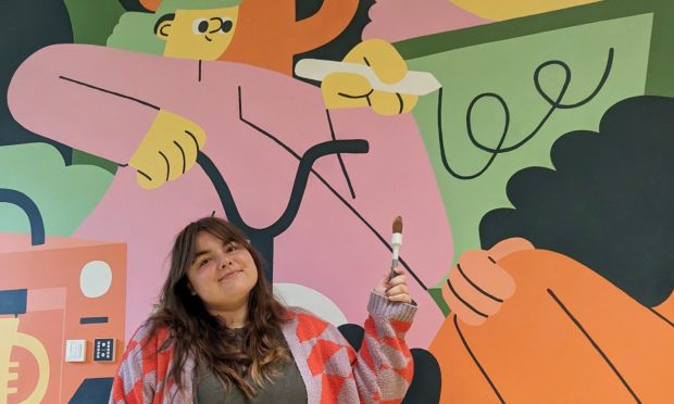 Lauren Morsley was commissioned to paint a mural in the Adam Smith Theatre, where she played clarinet growing up. Image: Lauren Morsley.