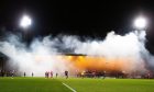 Dens Park was filled with smoke during the game. Image: Shutterstock
