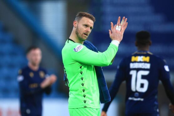 Trevor Carson salutes Dundee fans after beating Livi. Image: David Young/Shutterstock
