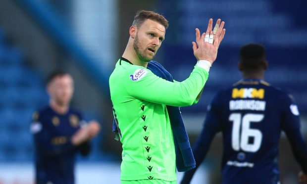 Trevor Carson salutes Dundee fans after beating Livi. Image: David Young/Shutterstock