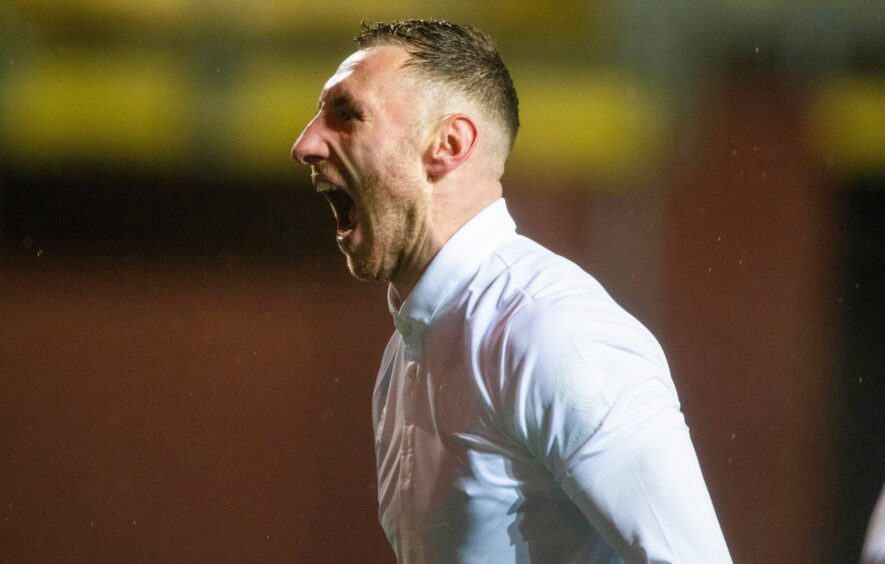 Louis Moult celebrates a goal fro Dundee United against Arbroath