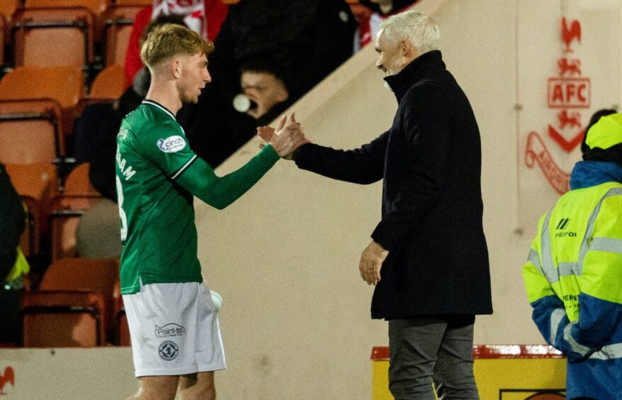 Kai Fotheringham, left, gets the acclaim of Dundee United boss Jim Goodwin