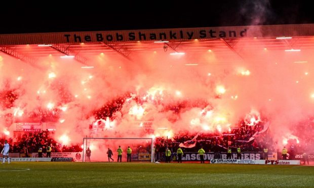 The match was paused due to flares being lit