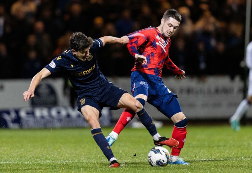 Dundee's Owen Beck battles with Rangers winger Scott Wright. Image: SNS