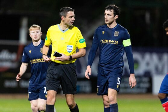 Dundee skipper Joe Shaughnessy speaks to referee Kevin Clancy. Image: SNS