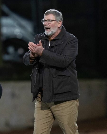 St Johnstone manager Craig Levein encourages his players from the touchline.