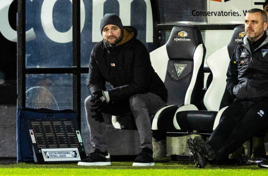 Dunfermline manager James McPake sits in the East End Park dugout. Image: SNS.