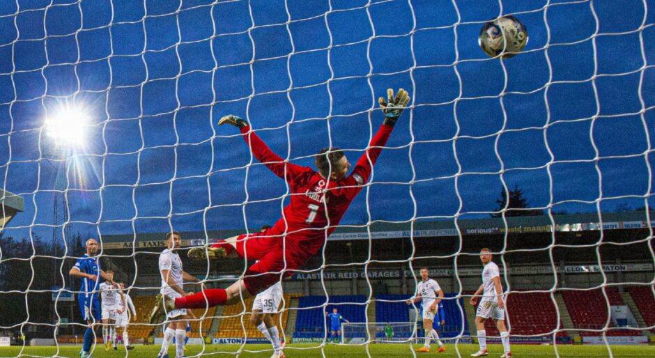 St Johnstone's Graham Carey scores his winning goal.