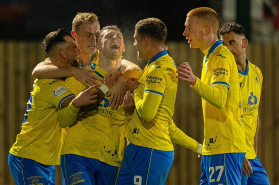 Jack Hamilton is surrounded by team-mates, including Jamie Gullan, after scoring for Raith. Image: SNS.