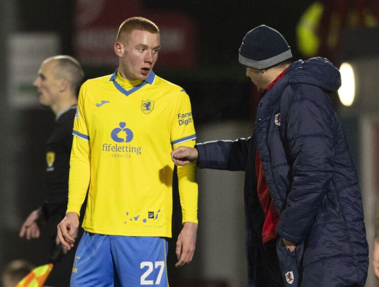 Callum Hannah gets instructions from manager Ian Murray before being introduced as a substitute against Hamilton Accies.