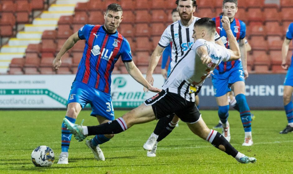 David Wotherspoon of Inverness and Dunfermline defender Josh Edwards compete for the ball.