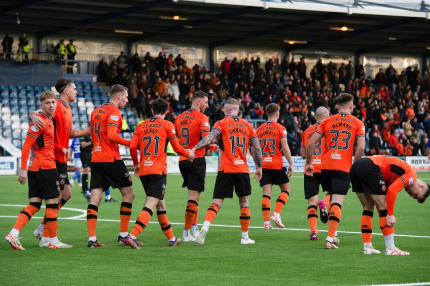 Dundee United players toast getting back into the game