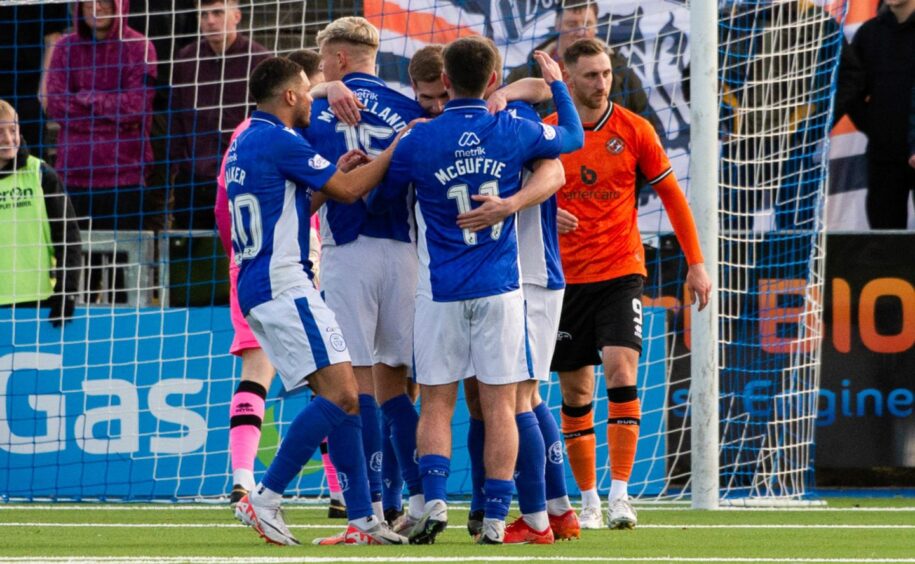 Queen of the South players celebrate Cammy Logan's first ever senior goal