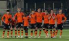 Nervous Dundee United players watch as the Tangerines lose on penalties against Dundee United