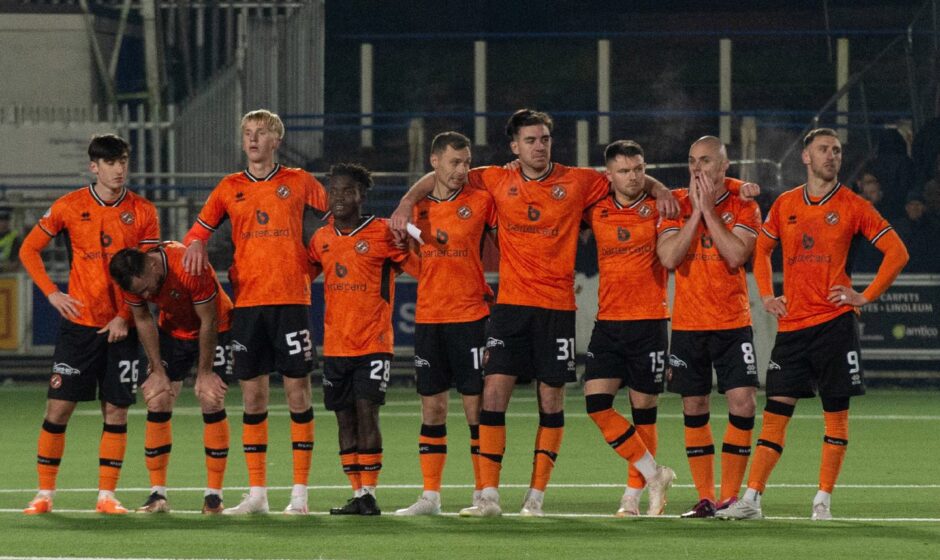 Nervous Dundee United players watch as the Tangerines lose on penalties against Dundee United