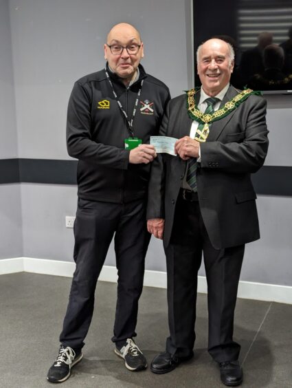 Grant Hutchison receives cheque from The Provincial Grand Lodge of Forfarshire
