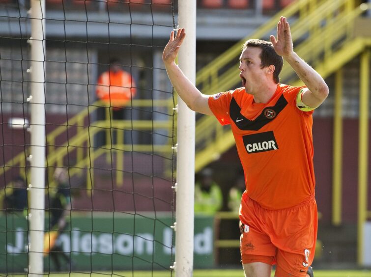 Jon Daly celebrates one of his 73 goals for Dundee United
