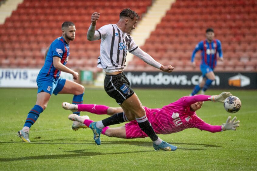 Dunfermline Athletic striker Lewis McCann squeezes his shot past the diving Inverness Caley Thistle goalkeeper, Mark Ridgers.