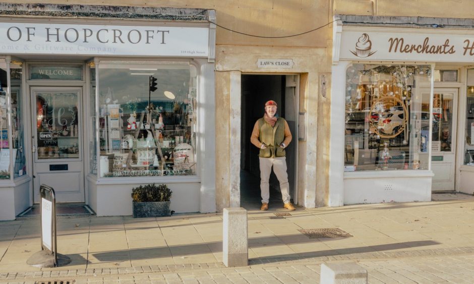 Colin outside the Merchant's House Cafe and gift shop Home of Hopcroft.