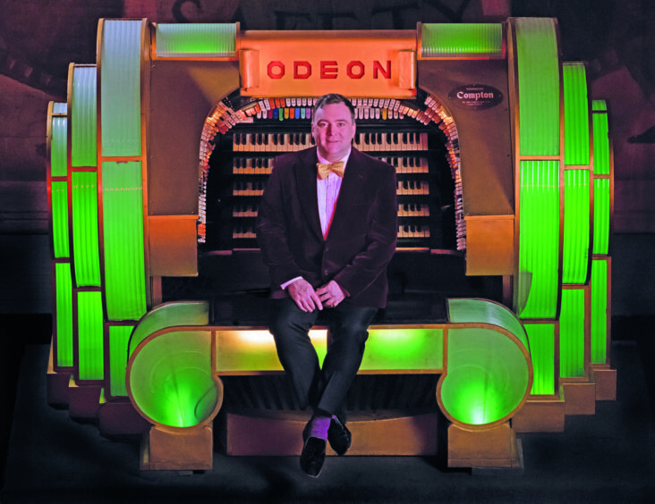 Donald MacKenzie with the Compton organ at Odeon, London. 
