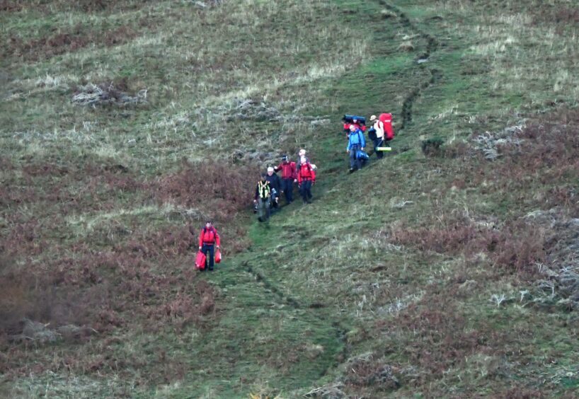 A mountain rescue team on Bishop Hill.