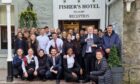 Hotel workers stand outside Fisher's Hotel, pitlochry, surrounding general manager Brian Wishart who is holding the 4-star status from VisitScotland