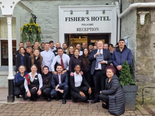 Hotel workers stand outside Fisher's Hotel, pitlochry, surrounding general manager Brian Wishart who is holding the 4-star status from VisitScotland