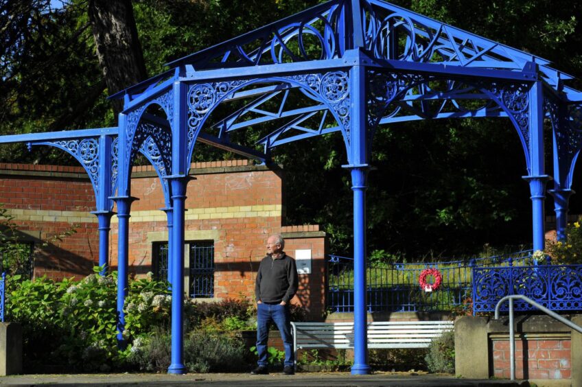 Image shows: Author George Burton standing in Balgay Park, Dundee, which is the setting of his new book. George is standing in a bandstand with his hands in the pockets of his jeans.