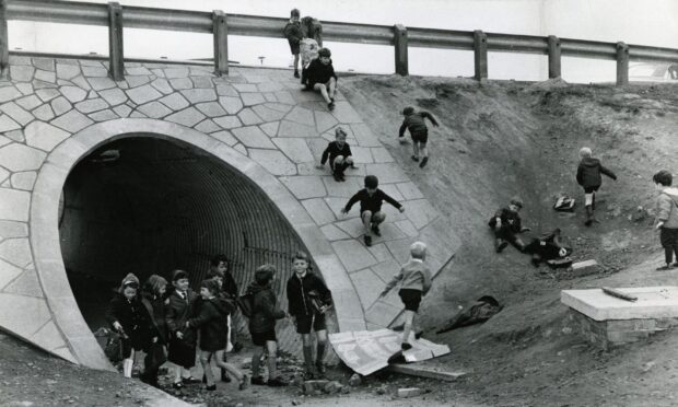 Children playing at the tunnel under Whitfield Drive in 1969. Image: DC Thomson.