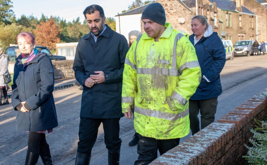 First Minister Humza Yousaf chats to Euan Clark in the aftermath of Storm Babet. 