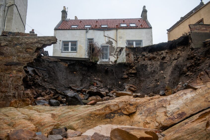 The scene of devastation at the end of Rob and Catherine's garden in Pittenweem,