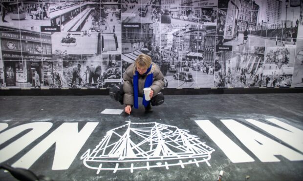 Illustrator Kate Benzie working on the floor design. Image: Kim Cessford/DC Thomson.