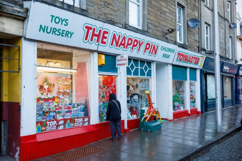 Image shows the exterior of The Nappy Pin and Toymaster shop in Broughty Ferry. The shop has been serving local customers for more than 50 years.