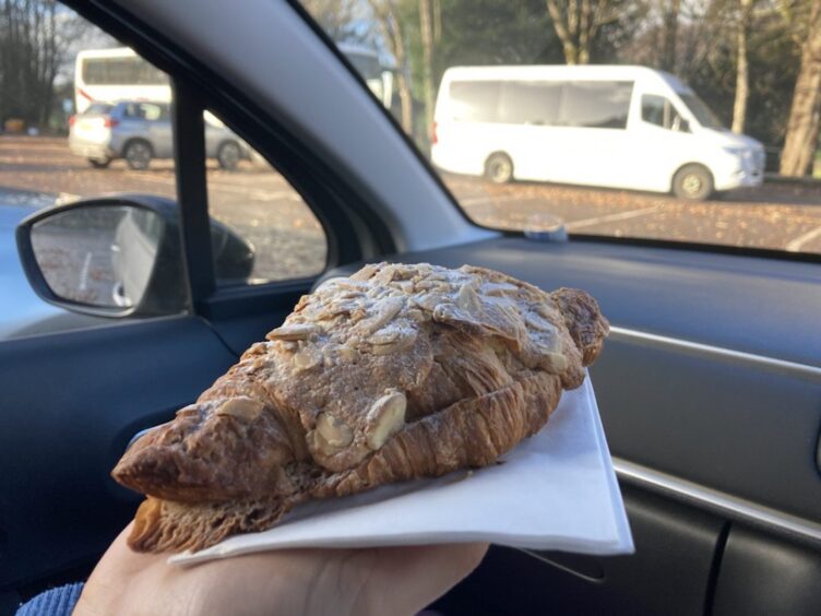 An almond croissant for the Aran Bakery in Dunkeld review sat on a napkin. 