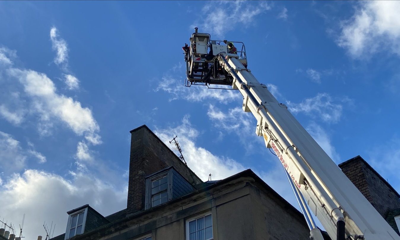 Firefighters attending to an aerial in George Street, Perth.