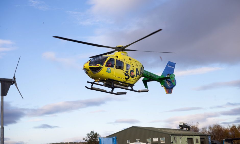 Scotland's Charity Air Ambulance leaving the scene after a child was hit by a car in Aberuthven.