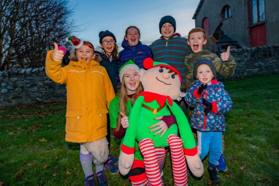 At the front is Kerry McBain (Illuminations Committee) with Elfred and back row, left to right is 
Amelia Strachan (aged 7), Ella Strachan (aged 11), Fia Tennant (aged 10), Nathan MacLeod (aged 12), James Tennant (aged 7) and Micah MacLeod (aged 3) Image: Steve MacDougall/DC Thomson