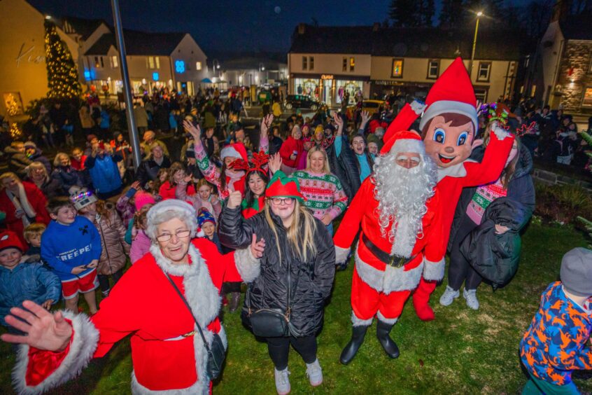 Santa, elf and large crowd at switch on of Auchterarder Christmas tree